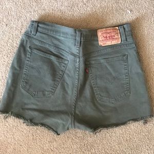 Olive green high waisted Levi’s cutoff shorts